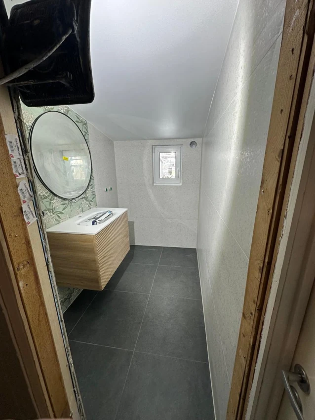 Moderne totalrenovering av bad i Liertun – Funksjonell eleganse bilde 5